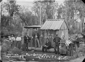 Men alongside the Post Office at Apiti
