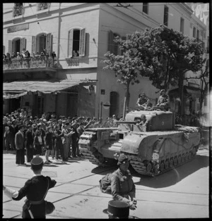 Gendarme directs Churchill tank through the streets of Tunis - Photograph taken by M D Elias