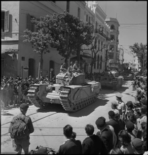 Churchill tanks pass crossroads in the streets of Tunis - Photograph taken by M D Elias
