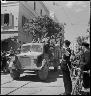 Gendarme directs truckload of tommies through the streets of Tunis - Photograph taken by M D Elias