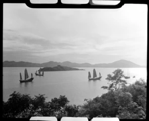 Junk boats at sail in a bay, Hong Kong