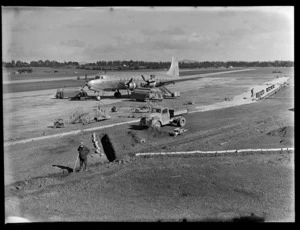 British Commonwealth Pacific Airlines aircraft RMA Endeavour at Whenuapai; drainage work is being carried out beside the runway
