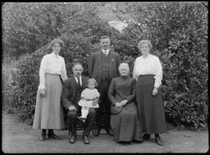 Group portrait of three women, two men, and a small girl, all unidentified, in an unidentified outdoor location, possibly Christchurch district