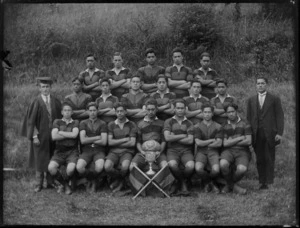 Te Aute College junior rugby team with cup and flags, Hawke's Bay District