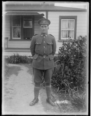 Soldier wearing World War I uniform outside house, Hawke's Bay District