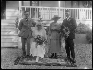Unidentified bride and groom with parents outside a house; groom wearing a military uniform, Hawke's Bay District