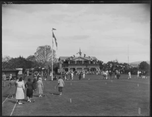 Opening of the Kaitoa Bowls and Croquet Club, with club members engaged in croquet games in front of club rooms, Hastings, Hawke's Bay District