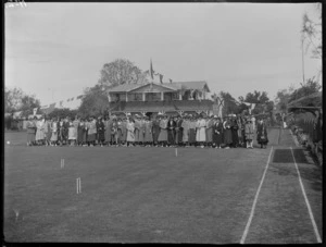 Opening of the Kaitoa Bowls and Croquet Club, with female members lined up for photo in front of club rooms, Hastings, Hawke's Bay District