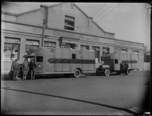 Two horse float trucks in front of the business premises of C H Slater Ltd, showing an unidentified group standing in front of the horse float trucks, Hastings