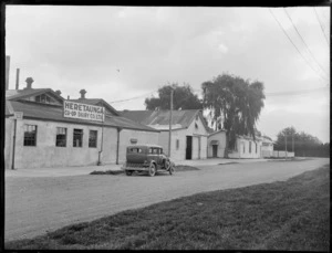 A motor car parked in front of the Heretaunga Co-op Dairy Co Ltd, Heretaunga Plains, Hawkes Bay