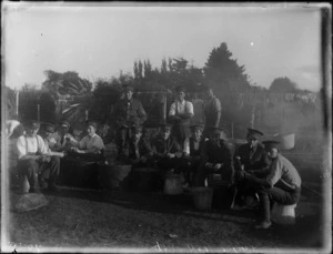 A group of unidentified soldiers peeling potatoes, at casual camp, Hastings