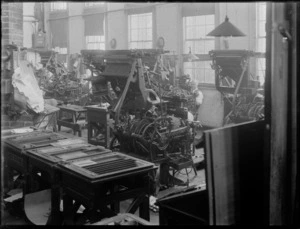 Two unidentified men working with printing presses, possibly Hastings region