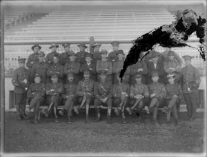 A group of unidentified soldiers standing in front of a stadium, at casual camp, Hastings