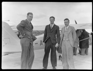 D Greig, left, with David Charteris and Harold Charteris, in front of a Auster Autocrat aeroplane, at RNZAC Pageant, Dunedin
