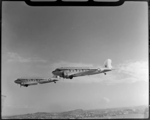 RNZAF (Royal New Zealand Air Force) Squadron 41, flying DC4 airplanes over North Shore, Auckland