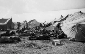 Wounded World War II prisoners of war alongside tents of the Main Dressing Station at Sidi Resegh, Libya