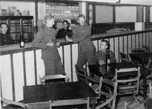 Members of the 1st Echelon at a bar on board ship after their departure from New Zealand