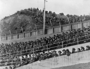 Spectators watching a rugby game between Wellington and Great Britain at Athletic Park, Wellington