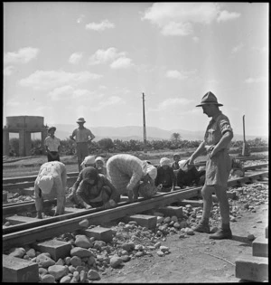 Local women laying ballast on railway track in Syria, World War II - Photograph taken by M D Elias
