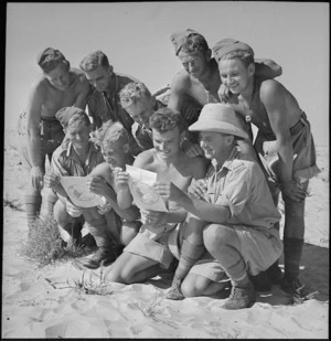 New Zealanders reading German pamphlet on Alamein front, World War II - Photograph taken by H Paton
