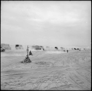 Convoy plows through soft sand in pursuit of Axis forces, Egypt - Photograph taken by H Paton