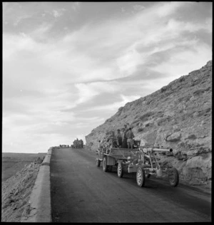 British armoured car leads convoy climbing Sollum Pass Road, Egypt - Photograph taken by M D Elias