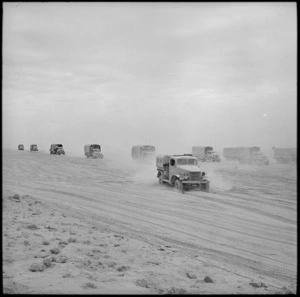 NZ convoy ploughing through soft sand in pursuit of Axis forces, Egypt - Photograph taken by H Paton