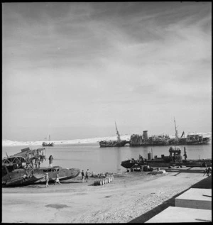 Wrecked Axis supply ship and demolished flying boat at Mersa Matruh Harbour, Egypt - Photograph taken by M D Elias