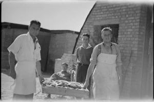 Cooks at 2 NZ General Hospital bring dinner from cookhouse, Egypt - Photograph taken by W Timmins