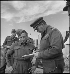 General Freyberg signs autograph book for Driver R H Swan, Libya, World War II