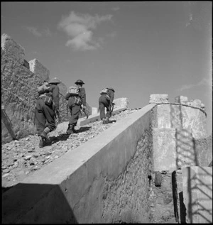 Troops climbing up to Italian fort's ramparts at Cyrenaica, Libya - Photograph taken by M D Elias