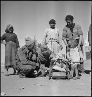 New Zealand Engineers with Italian colonial children, Tripolitania - Photograph taken by H Paton