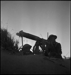NZ machine gunners in position at dawn near Azizia, Libya - Photograph taken by H Paton