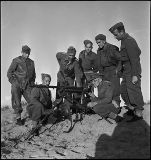 Group of Taranaki machine gunners examining a captured Spandau, Libya - Photograph taken by H Paton