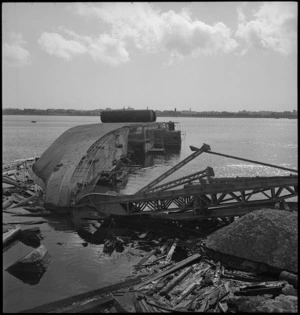 Wrecked ship on its side near the shore of Tripoli Harbour - Photograph taken by H Paton