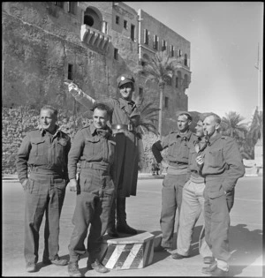 Group of New Zealanders on leave in Tripoli receiving directions from an Italian traffic policeman - Photograph taken by H Paton