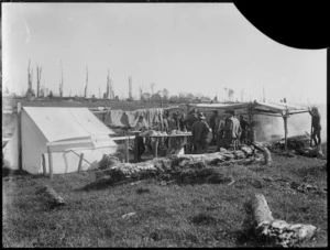 Mounted riflemen by camp cookhouse