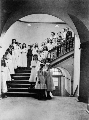 Pupils of Queens College, Harley Street, London, stand on the P Feiffer Stairs at the College