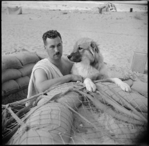 Captain Tomlinson with regimental canine mascot Mitro, Baggush, Egypt