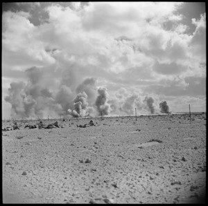 Infantry on manoeuvres in the Western Desert with artillery in support