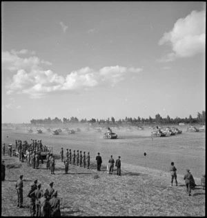 NZ Divisional Cavalry passing saluting base before Prime Minister of Great Britain in Tripoli, World War II - Photograph taken by H Paton