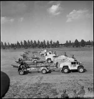 25 pounders of NZ Division passing in review before Prime Minister of Great Britain in Tripoli, World War II - Photograph taken by H Paton