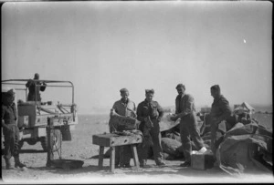 Representatives of NZ Units collecting their rations at a DID in the Western Desert - Photograph taken by W Timmins