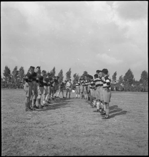 Divisional Signals and Maori rugby teams line up at Tripoli, World War II - Photograph taken by H Paton