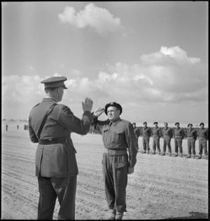 Sergeant W Goodmanson receives the Military Medal from General Freyberg at Maadi, World War II - Photograph taken by M D Elias