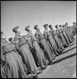 Men at a NZ Con Depot listening to an address by Hon Frederick Jones, Palestine, World War II - Photograph taken by S Wemyss