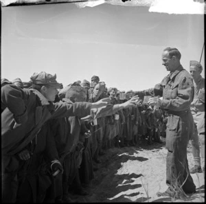 Italian prisoners being supplied water by NZers, Tunisia - Photograph taken by H Paton