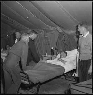 New Zealand Defence Minister, Hon Frederick Jones, meeting a patient at 2 NZGH, Egypt - Photograph taken by S Wemyss