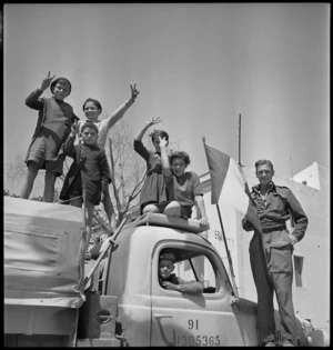 Inhabitants of Sousse show enthusiasm towards NZ troops, Tunisia, World War II - Photograph taken by H Paton