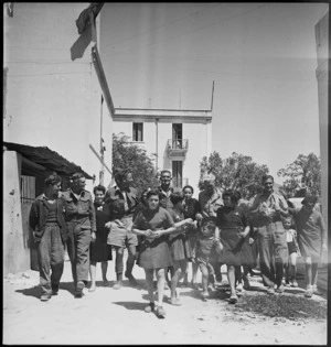 New Zealanders with the children of Sousse, Tunisia, in World War II - Photograph taken by H Paton
